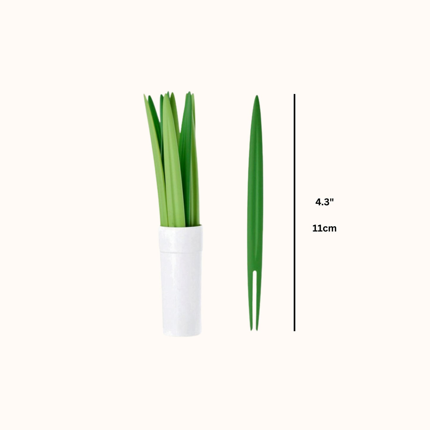 Green grass-shaped snack picks in a white pot with measurement label on a white background